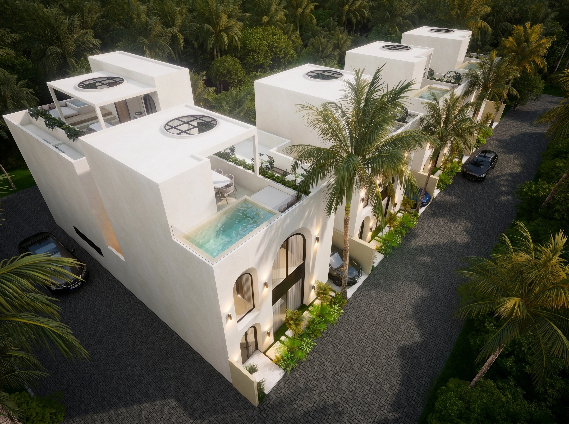 Aerial side angle with rooftop pools lit